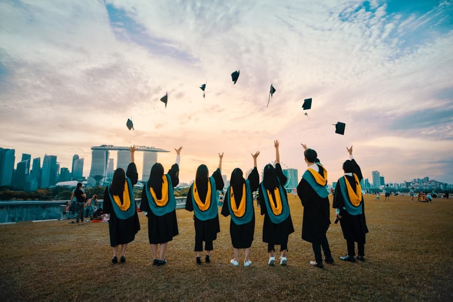 Graduates in gowns throwing their caps